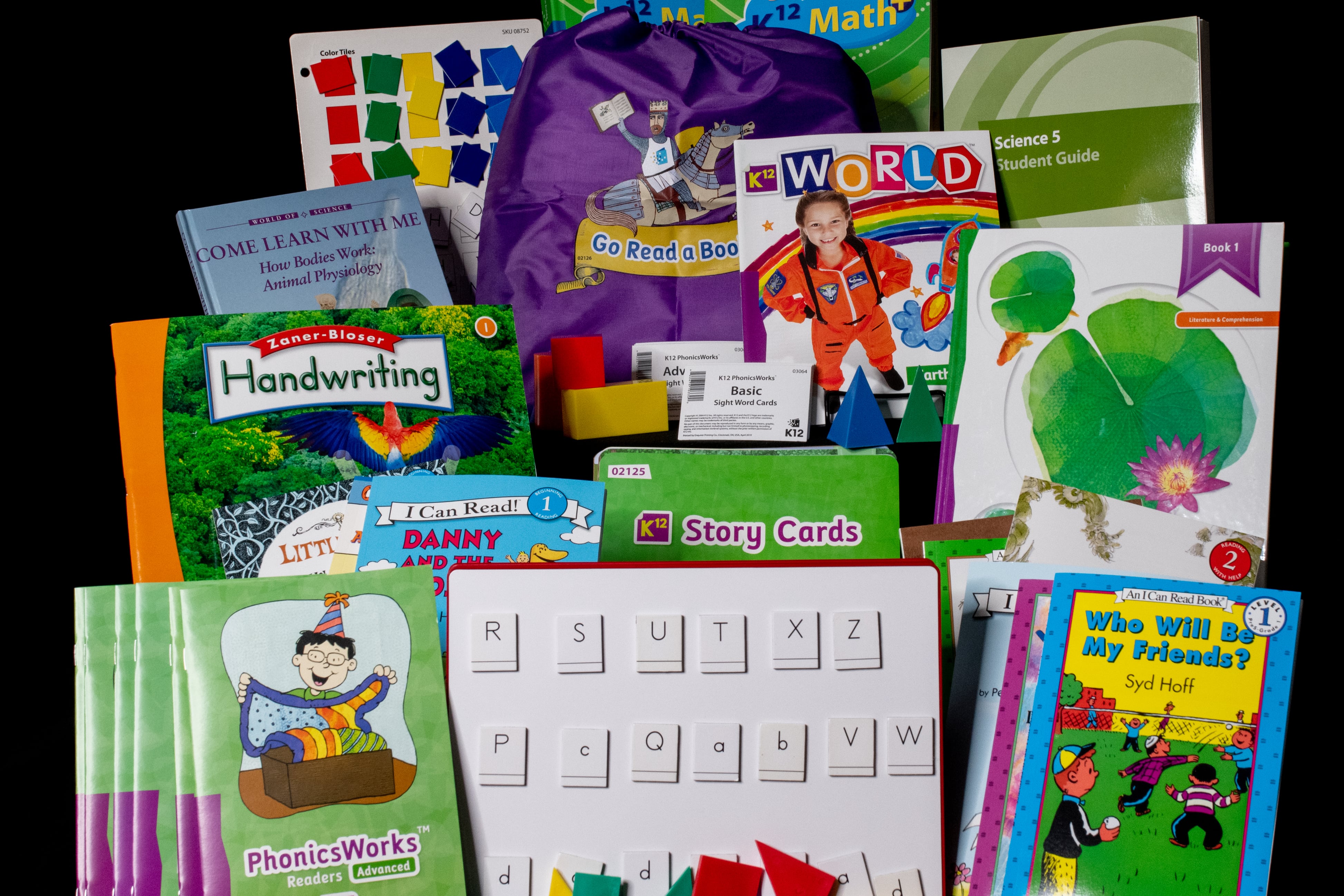 Sample curriculum for elementary school, including books, learning tools, math workbooks, letter boards, and more