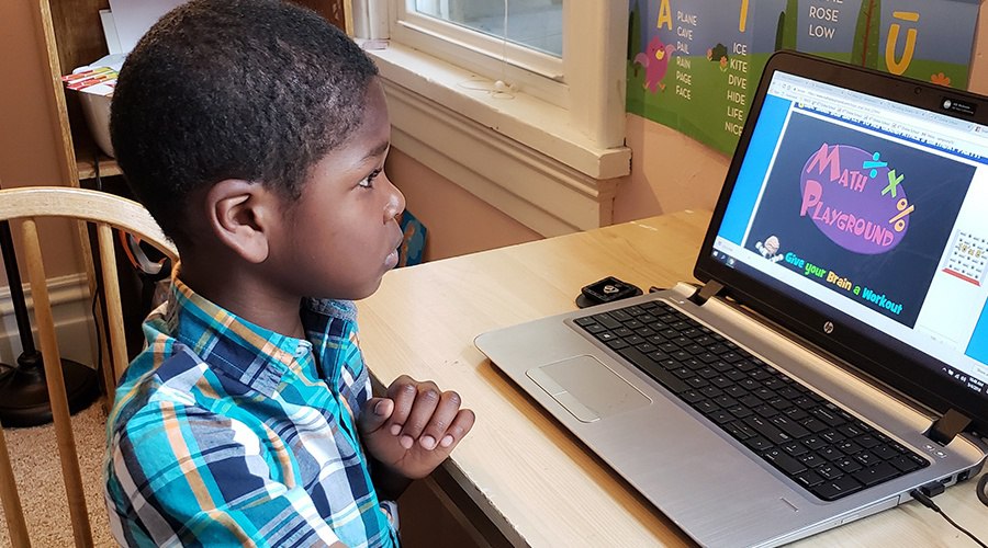 student in a virtual math class using laptop