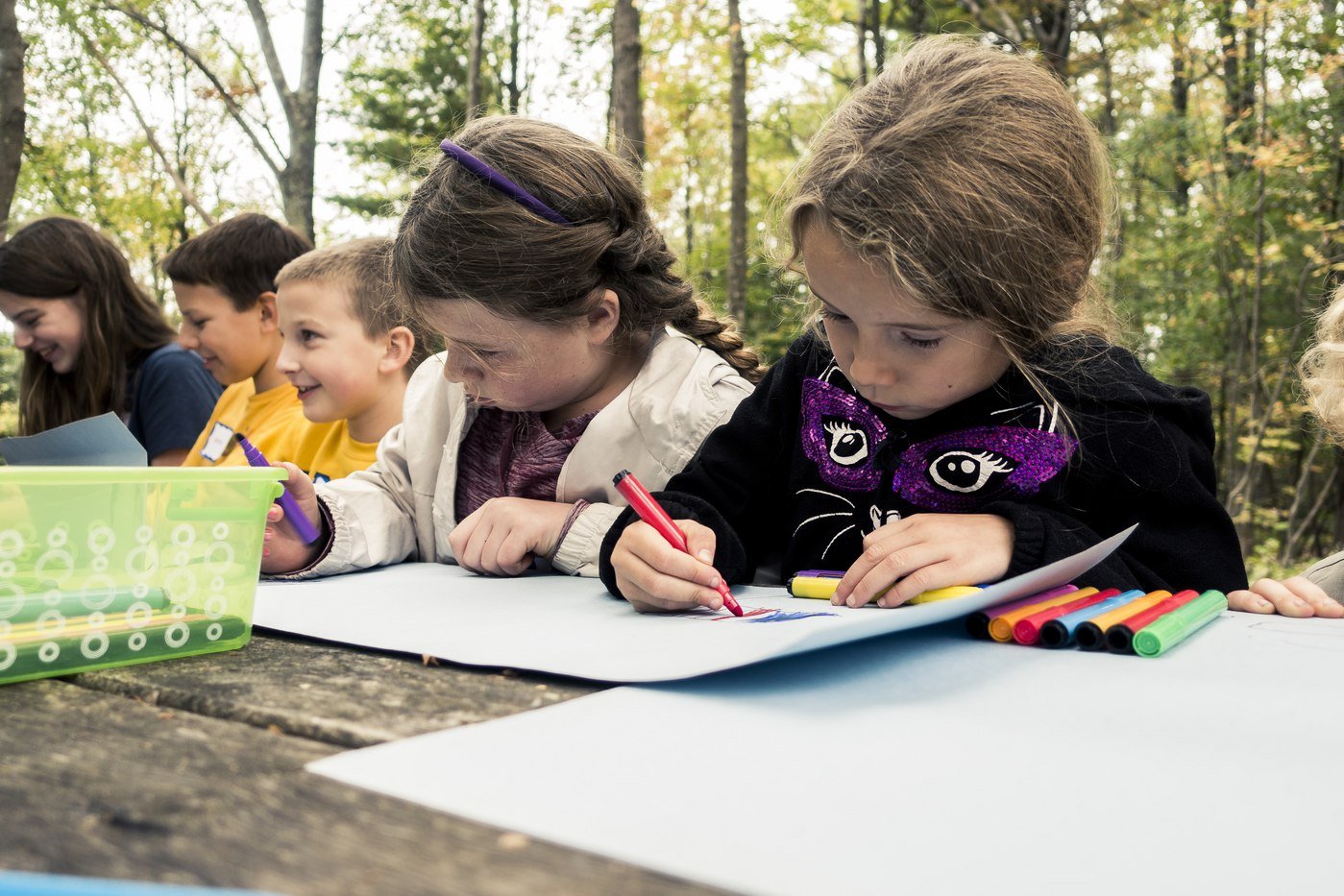 PA cyber school kids drawing together at picnic table