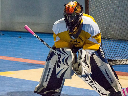 male teen playing hockey